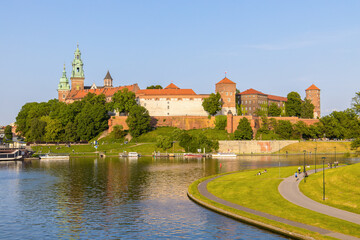 Krakow in Poland at the Wisła river bank with historic building such as Wawel castle and cathedral