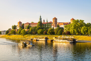 Idyllic Krakow city centre in Poland with Wawel castle at the Vistula river during sunset