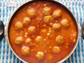 delicious meatballs with chickpeas cooked in tomato sauce