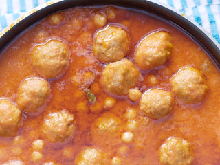 delicious meatballs with chickpeas cooked in tomato sauce