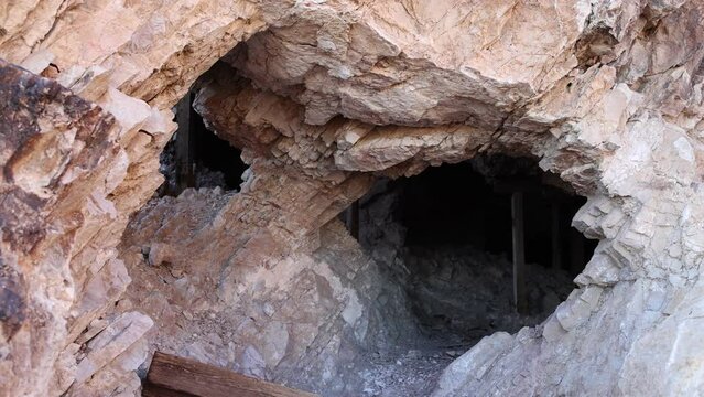 Crumbling Rock Entrance to Abandoned Mine with Timber Supports - Shallow Depth of Field