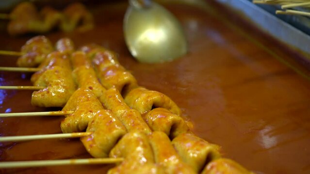 Korean street food hot fish cake soup Eomuk gochujang red spicy sauce