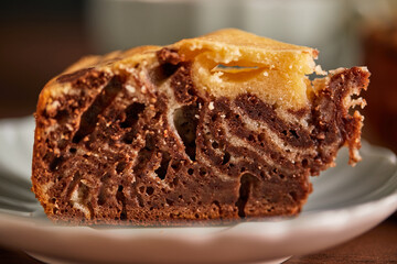 Chocolate and Vanilla Zebra Pie with piece cut off on plate. Homemade marble cake chocolate