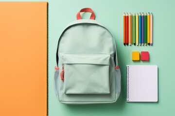 school backpack with pencils and supplies on a green background, Generative AI - obrazy, fototapety, plakaty