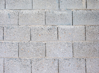 Concrete block empty wall background texture, grey color blank cement surface backdrop. Copy space