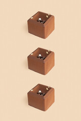 Fototapeta premium Chocolate mousse cake pattern on beige background