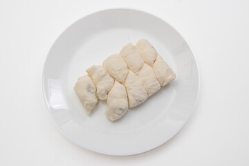 Thai desserts - Cocoon candy or Chinese cotton candy  in white dish on white background.