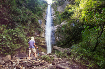 Hiker near waterfall