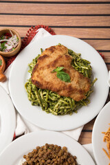 Green sauce pesto pasta Food buffet peruvian table Assorted dishes gourmet cuisine Peru traditional 