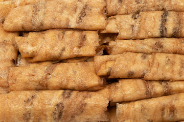 Thai dessert - Texture skin of Baked banana rolls. Brown skin of dried fruit