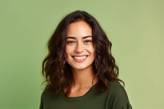 Smiling businesswoman, in front of green background, beautiful dark-haired woman in shirt, profile photo, isolated photo of people, employee photo