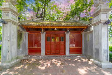 Old Apartment house block in Hanoi Old Quarters Vietnam narrow tall houses with plants on exterior of the building colourfully decorated 