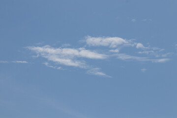 Blue Sky and small cloud in sunshine day with selective focus. Sky background and texture.