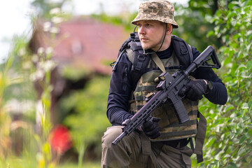 A soldier or mercenary inspects the area around