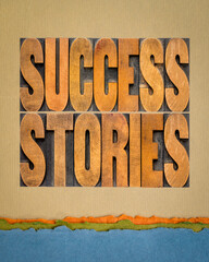 success stories typography - word abstract in vintage letterpress wood type on art paper, career, business or personal development concept