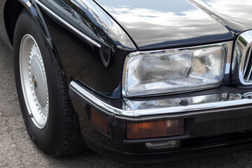 Obraz na płótnie Canvas Headlight on a retro car. Close-up.