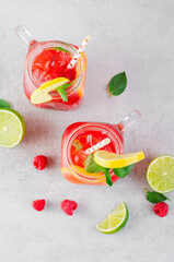 Refreshing Cold Cocktail or Mocktail with Berries and Lime, Raspberry Lemonade