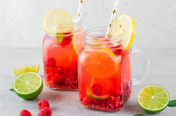 Refreshing Cold Cocktail or Mocktail with Berries and Lime, Raspberry Lemonade