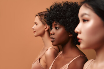 Multiethnic women on beige background