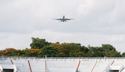 the plane is landing on a cloudy day