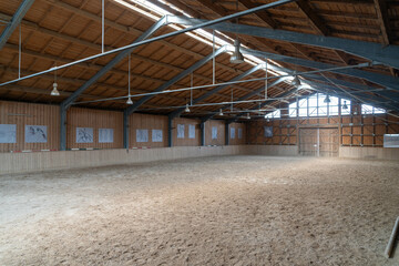 indoor horse riding arena with sand ground