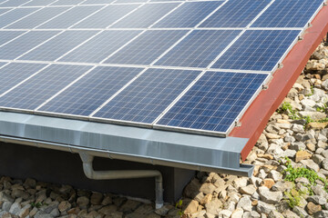 blue solar panels on the roof, roof edge and gutter