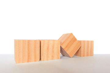 Four wooden cube blocks are placed on a gray table, isolated on white background. business concept.PNG