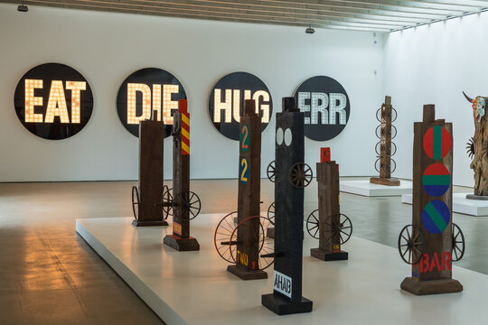 Columns and Herms works by Robert Indiana, as displayed in gallery spaces at Yorkshire Sculpture Park, UK.