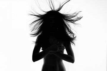 female silhouette. Nude body woman with flying Hair