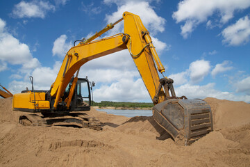 Excavator. The excavator is working on loading sand. Special equipment is used for construction.