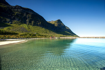 Serene beach with turquoise waters and rocky mountain