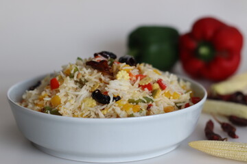 Chilly garlic vegetable rice. Mildly spiced garlic flavored basmati rice with sauteed bell pepper and baby corn