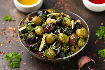Marinated olives with fresh herbs, garlic, red wine vinegar and lemon zest