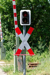 Reference to a level crossing, traffic lights and St. Andrew's cross