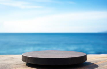Black Stone Podium Or Stand For Your Product In Front of the Sea. High quality photo