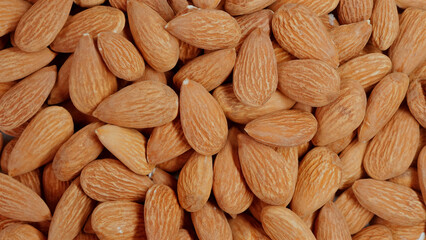 Close-up of organic, peeled almonds. Nutty, crunchy snack packed with protein and vitamins. Concept of healthy eating and nutrition.