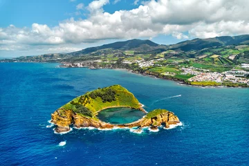 Foto op Aluminium Aerial shot, drone point of view of picturesque Islet of Vila Franca do Campo. Sao Miguel island, Azores, Portugal. Heart carved by nature. Bird eye view. Travel attraction and natural wonders concept © Alex Tihonov