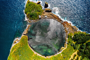 Aerial shot, drone point of view of picturesque Islet of Vila Franca do Campo. Sao Miguel island,...