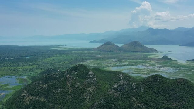 Aerial view of beautiful Skadar Lake between mountains at summer, Montenegro, panorama 4k