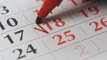 The eighteenth date on the calendar is marked in bold red as an important date. Close-up.