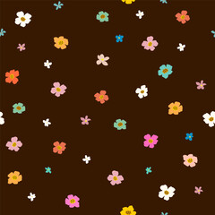 Fototapeta na wymiar Seamless floral pattern. Multicolored small simple flowers on a dark background. Botanical fashion print for women's dresses