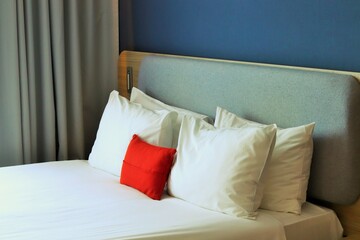 A neatly made king size bed in a hotel