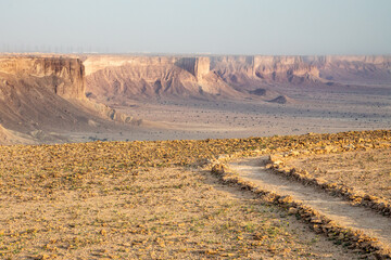 Hiking trail in the Jabal Tuwaiq Mountains, with desert below landscape, Riyadh, Saudi Arabia