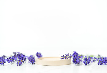 Minimal cosmetics and skin care product presentation scene made with lavender flowers and round...