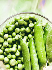 Harvest organic vegetables green peas.