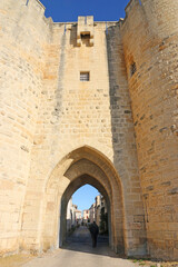 Fototapeta na wymiar City walls and gatehouse in Aigues-Mortes in France
