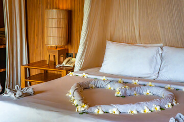 Bedroom inside a cabin on the beach in Haad Tien Beach in shark bay, koh Tao, Thailand
