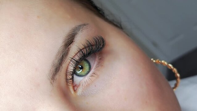 Close up of eye with eyelash extensions ,beauty salon treatment ,2d volume, 3d volume, classical lashes,Russian volume,megavolume, new set