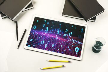 Creative abstract binary code hologram on modern digital tablet display, AI and machine learning concept. Top view. 3D Rendering