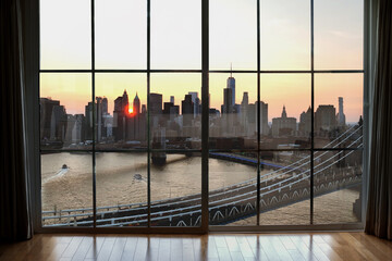 Manhattanhenge sun setting between two buildings at sunset in Manhattan skyline New York City NYC...